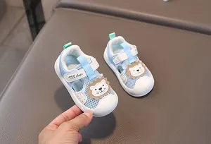 Detail of baby mesh sandals featuring a cute 3D lion head and velcro strap design
