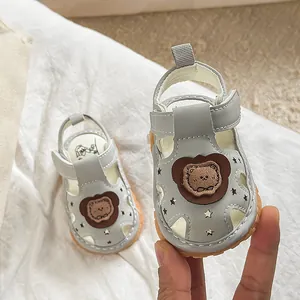 Soft-soled infant boy summer sandals with bear pattern and star cutouts in light gray