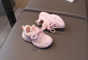 Detailed top view of pink kids mesh sneakers with textured anti-slip rubber soles