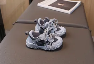 Close-up of kids' breathable grey-blue sneakers showing mesh texture and non-slip sole details