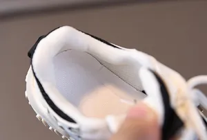 Detailed macro view of the padded heel lining and mesh interior of kids sneakers