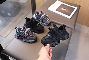 Detail view of mesh and leather kids sneakers with anti-slip thick sole and velcro strap
