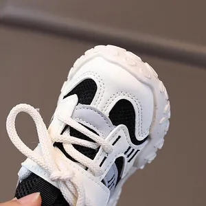 Kids' breathable mesh sneakers with non-slip thick soles in black, white, and gray
