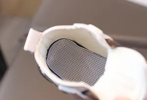 Macro detail of breathable honeycomb mesh insole and inner lining for children shoes