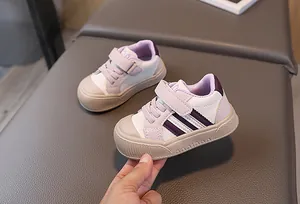 Detail view of toddler sneakers with purple accents and anti-slip thick rubber soles