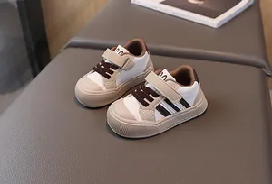 Detail of baby sneakers featuring multi-color patchwork and non-slip thick soles