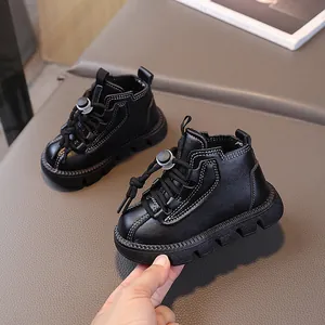 Classic black leather toddler boots with white contrast stitching and durable rubber soles