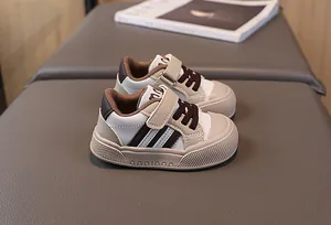 Detail of baby sneakers with non-slip rubber soles and convenient velcro closure