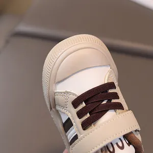 Toddler cream athletic sneakers with velcro strap and rubber toe protection