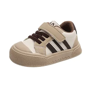 Infant sports sneakers in beige and brown color-block design with non-slip rubber soles