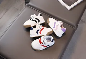 Detailed view of kids sneakers featuring velcro closure and anti-collision toe design