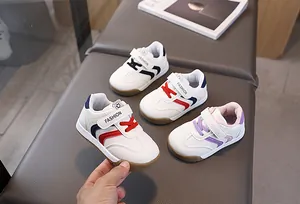 Detailed top view of toddler walking shoes with velcro straps and anti-slip soles