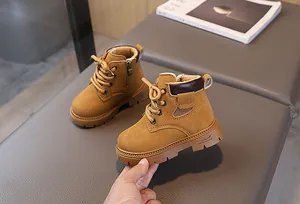 Detail of warm faux shearling lining and side zipper on children's tan martin boots