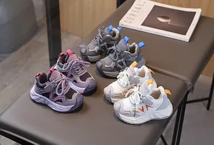 Top view of multi-color children's sneakers with lace-up and velcro strap closure