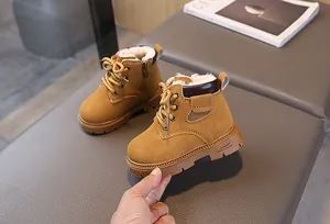 Detailed view of warm winter boots for kids with cozy faux shearling lining and side zipper
