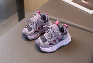 Detail of purple toddler sneakers with hook-and-loop closure and non-slip sole
