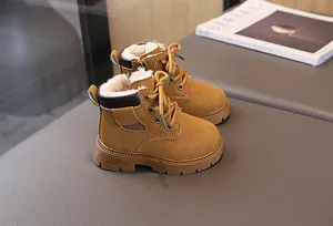 Detail view of winter children boots with plush faux shearling lining and side zipper