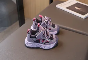 Close-up of purple kids' sneakers featuring breathable mesh and velcro closure detail