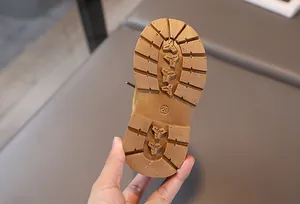 Detailed view of the anti-slip rubber sole with size 23 mark on children's boots