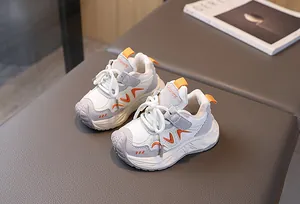 Detail view of children's sneakers with thick non-slip soles and velcro straps