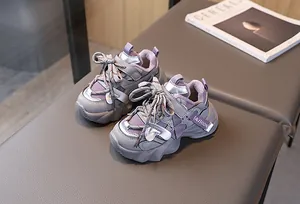 Detail view of purple and grey chunky sneakers for children with warm fleece lining