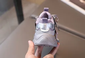 Detail of purple children sneakers showing warm plush lining and thick anti-slip sole