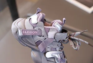 Detail of warm purple fleece lining and leather stitching on kids' winter sports sneakers
