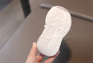 Detailed macro view of the non-slip rubber sole showing traction patterns and size 23 mark