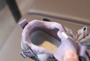 Detailed macro view of purple plush lining in children sports sneakers for winter warmth
