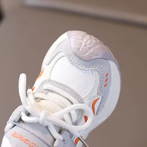 Kids fashion sneakers in white and orange with breathable mesh and leather splicing