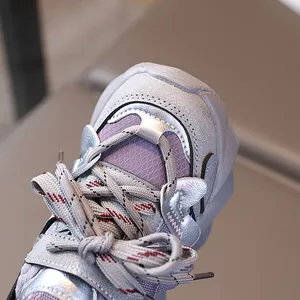 Silver kids' sneakers with purple mesh and 3D butterfly decor from a side view