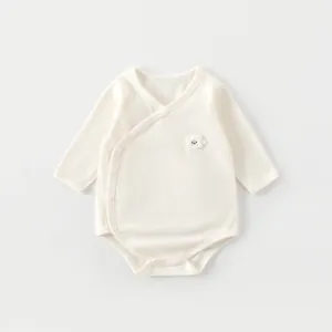 Detailed view of bamboo fiber baby bodysuit with 3D sheep embroidery and side snap buttons