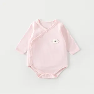 Detailed view of pink bamboo fiber baby bodysuit with breathable texture and lamb patch