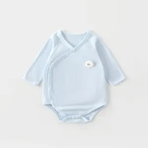 Detail of light blue bamboo fiber baby bodysuit with sheep embroidery and side buttons