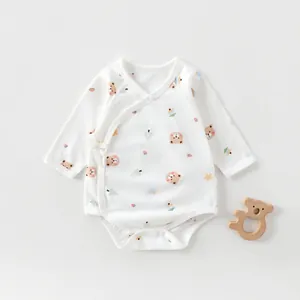Detail of pure cotton newborn kimono bodysuit with bear prints and side-tie design