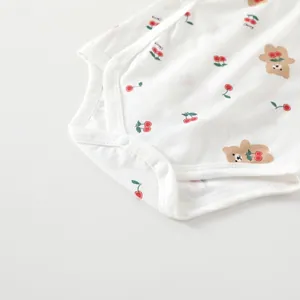 White cotton baby bodysuit with cute cherry and bear prints and snap closures