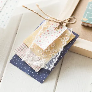 Handmade scrapbooking paper set with floral cardstock, white lace, and jute twine trim