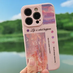 Pink aesthetic iPhone case with oil painting sunset design and scenic lake background