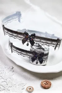 Detail of shell-shine PET tape with black lace and bow designs for scrapbooking