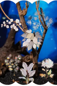 Macro view of holographic PET floral stickers featuring maple and daisy designs