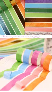 Gros plan sur un ensemble de rubans washi colorés avec dégradés arc-en-ciel et paillettes