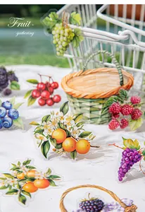 Macro detail of vintage fruit stickers featuring grapes and berries for DIY scrapbooking