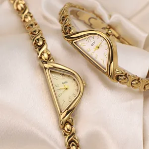 GEDI luxury gold women watch with unique triangle case and X-shaped metal bracelet