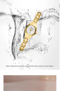 Montre à quartz GEDI dorée étanche avec bracelet en métal dans des éclats d'eau
