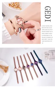 Close-up of rose gold watch and screw motif bangle set with floral perfume props