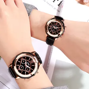 Elegant GEDI couple watches with rose gold cases and black leather straps on white book