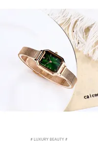 Detail of GEDI rectangular watch with emerald sunray dial and gold Milanese mesh band