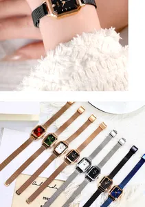 Close-up of elegant women's rectangular quartz watch with mesh band and colorful dials