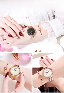 Close-up of golden bamboo-style quartz watch with matching star bracelet set