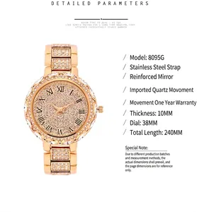 Detail view of gold women's watch with rhinestone-encrusted dial and steel band
